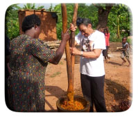 Lillian is hard at work pounding pine nuts